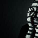 moody cinematic visual for Beautiful Cage by Luke Ai Music showing dramatic shadows and introspective atmosphere