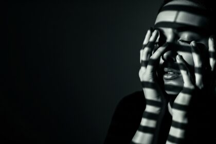 moody cinematic visual for Beautiful Cage by Luke Ai Music showing dramatic shadows and introspective atmosphere