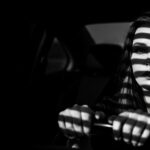 dramatic shadow portrait visual for Engine Running by Luke Ai Music representing emotional tension and unresolved conversation