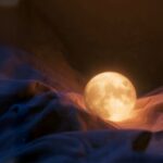 Soft Place to Land by Luke Ai Music artwork showing a glowing moon resting in soft flowing fabric symbolizing calm, healing, and emotional comfort