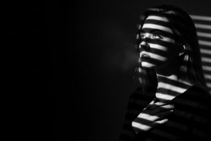 dramatic shadow portrait visual for Still Here by Luke Ai Music representing lingering memories and emotional reflection