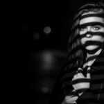 dramatic shadow portrait visual for Still Wet Pavement by Luke Ai Music symbolizing lingering memories and emotional aftermath