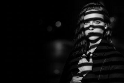 dramatic shadow portrait visual for Still Wet Pavement by Luke Ai Music symbolizing lingering memories and emotional aftermath