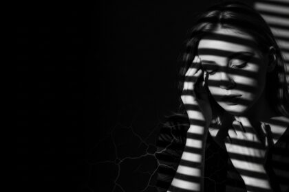 dramatic shadow portrait visual for The Lake Remembers by Luke Ai Music symbolizing hidden memories rising to the surface