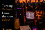 A rooftop gathering at sunset with city lights, a portable speaker, headphones, and a weekend playlist featuring the quote "Turn up the music. Leave the stress behind." from Luke Ai Music Daily Vibes #009.
